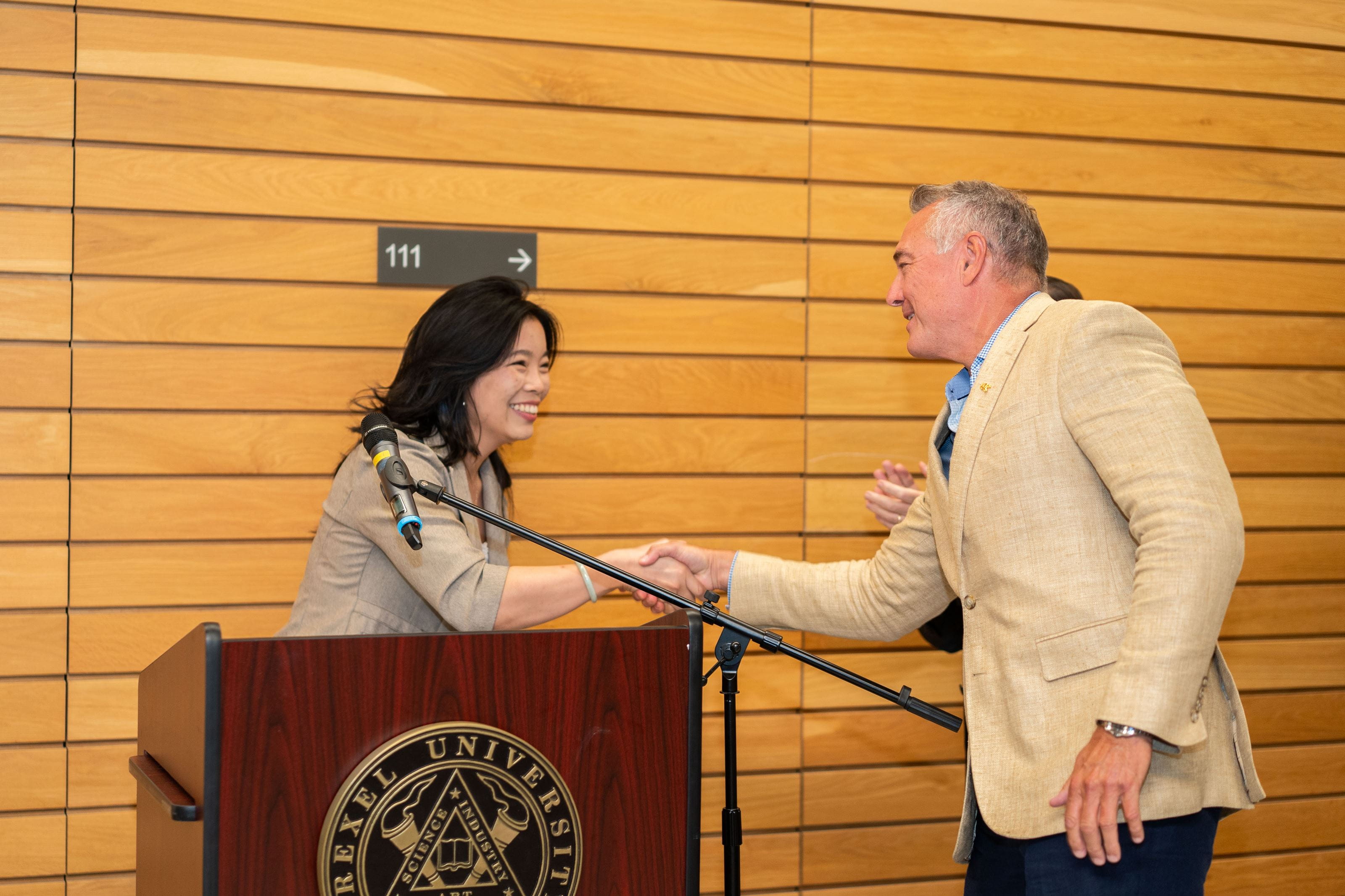 Brenda and Patrick shake hands. 