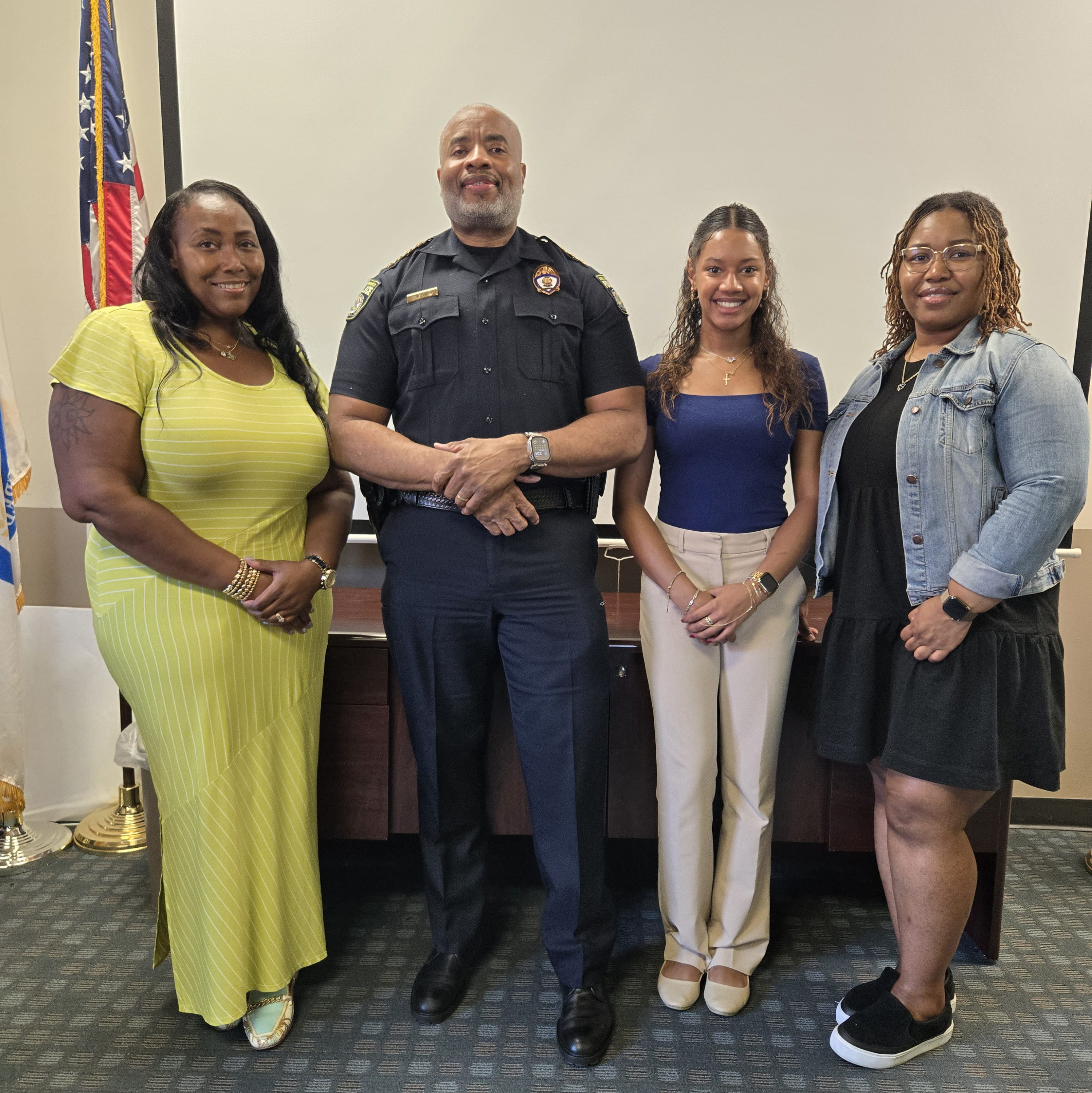 Elina Urquhart (second from right), Public Safety’s spring/summer co-op, poses with (from left to right) Director of Communications Caneshia Bailey, Vice President and Chief of Police Mel Singleton Jr., and Lead Dispatcher Supervisor Stephanie Jones