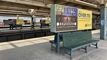 Drexel advertisements above benches in 30th Street Station.