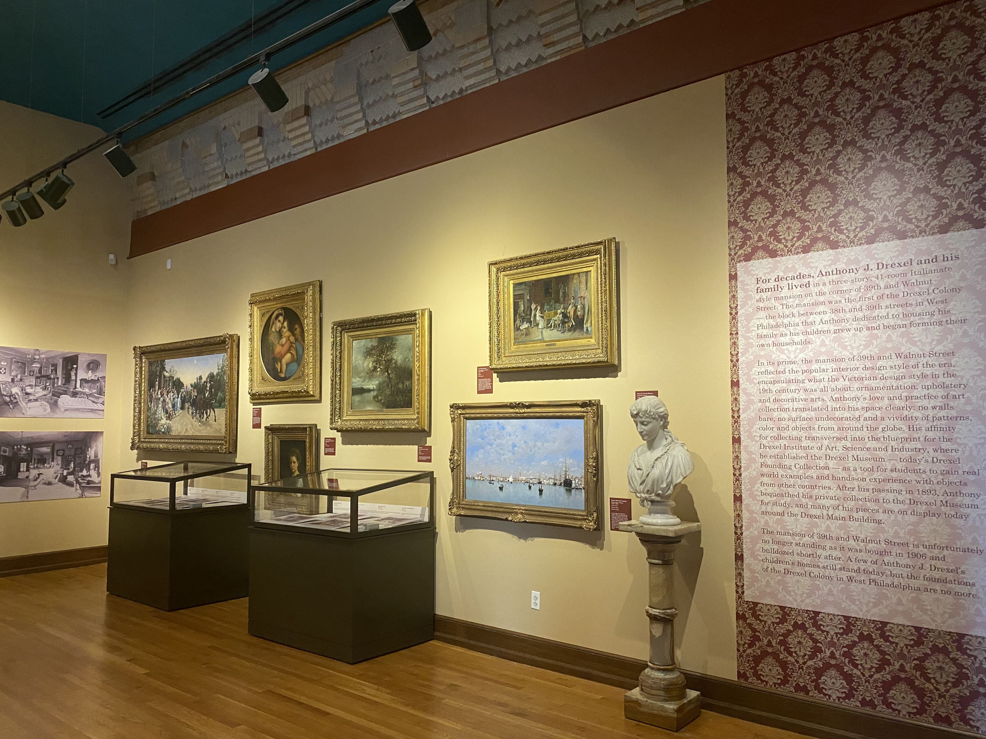A side of the "If These Walls Could Talk" exhibition showing "After the Wedding" and other paintings and objects from The Drexel Founding Collection.