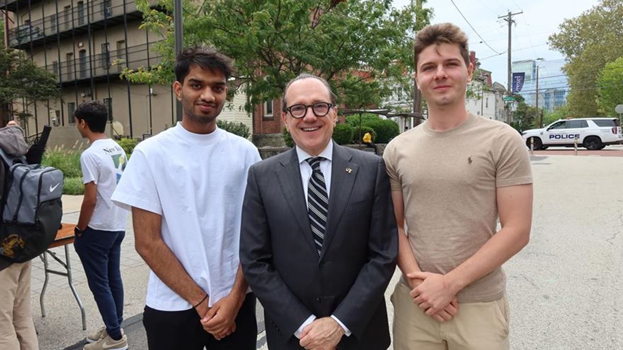 President Merlo with students