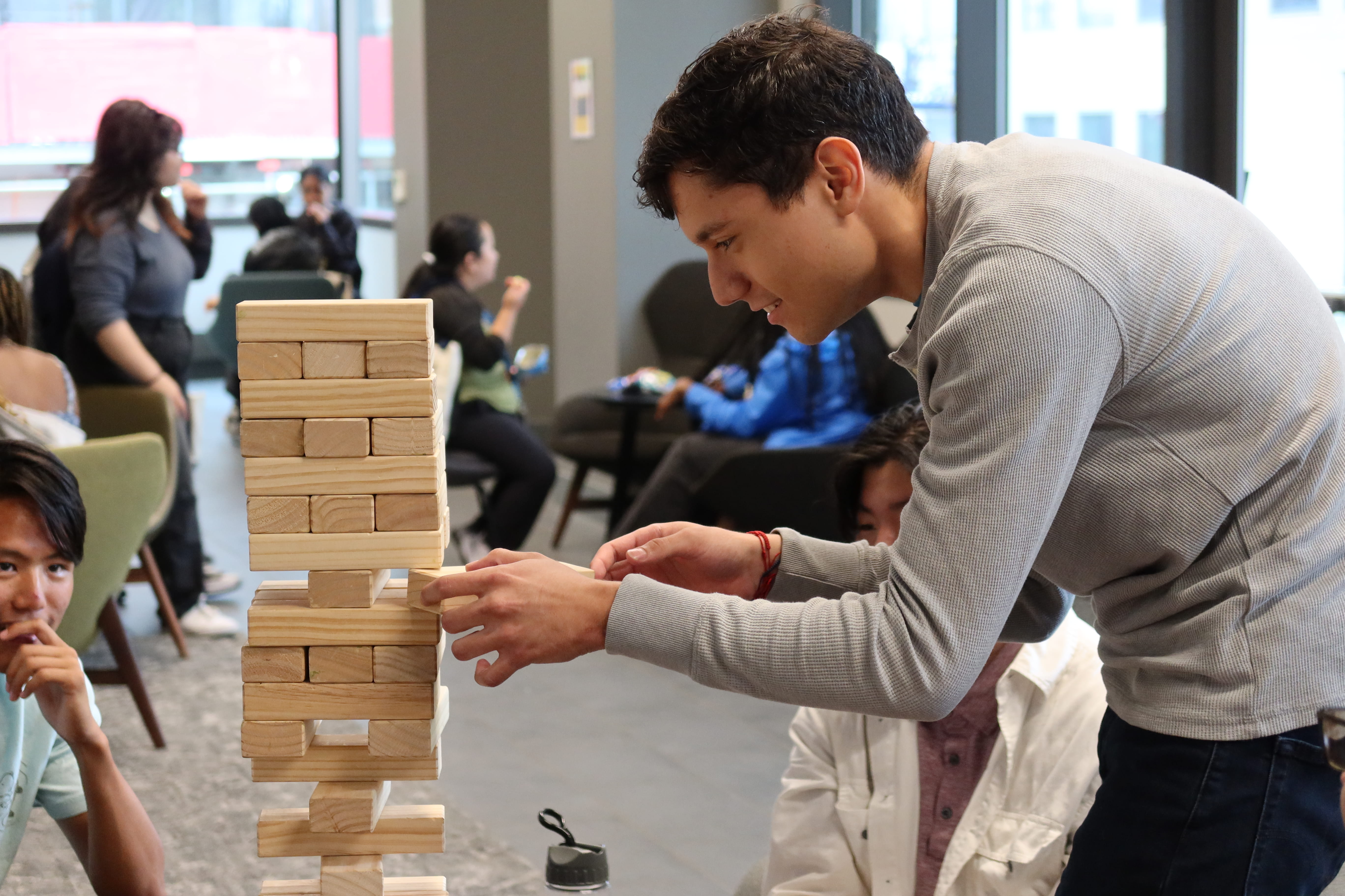 Student playing jenga