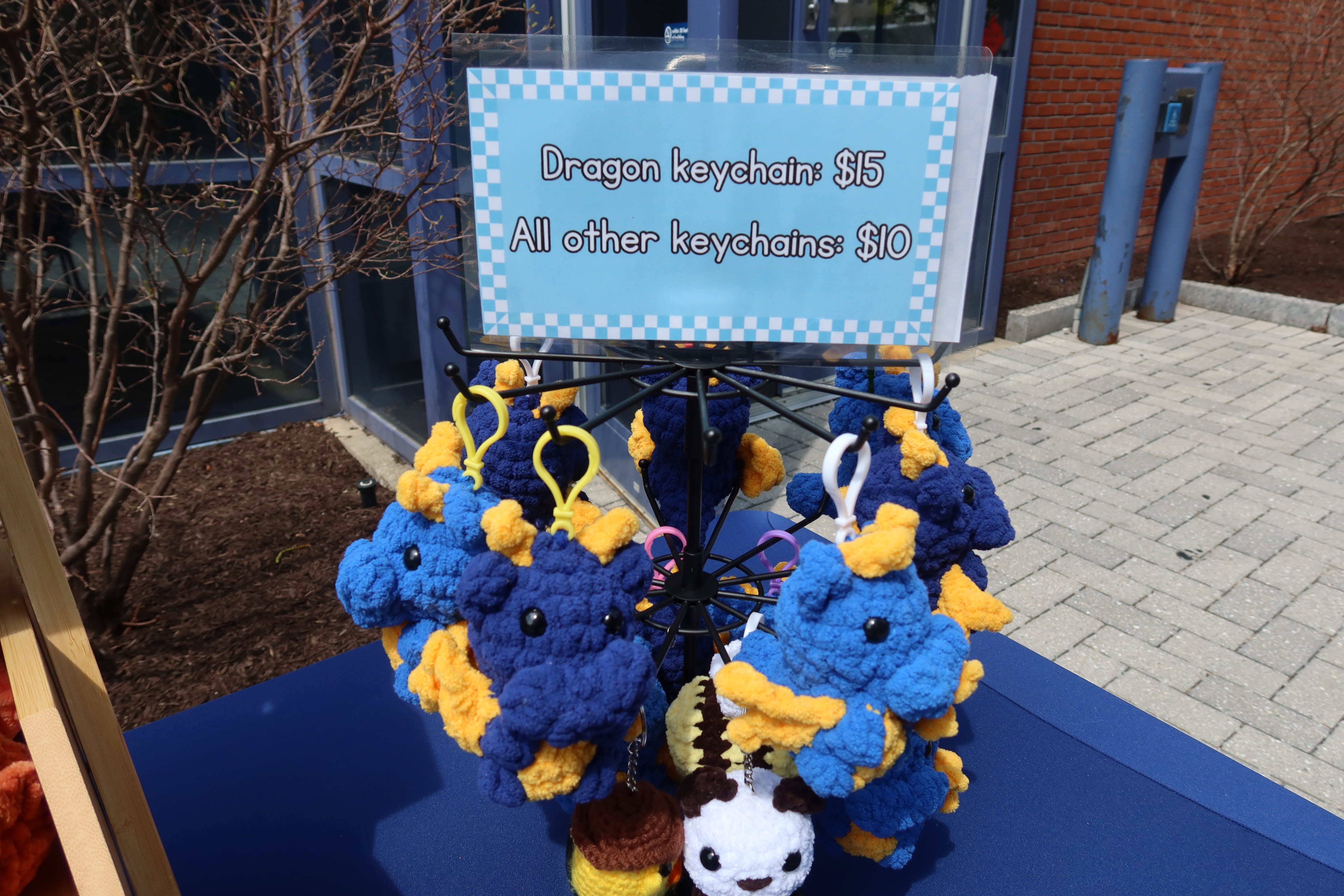 Student selling dragon keychains
