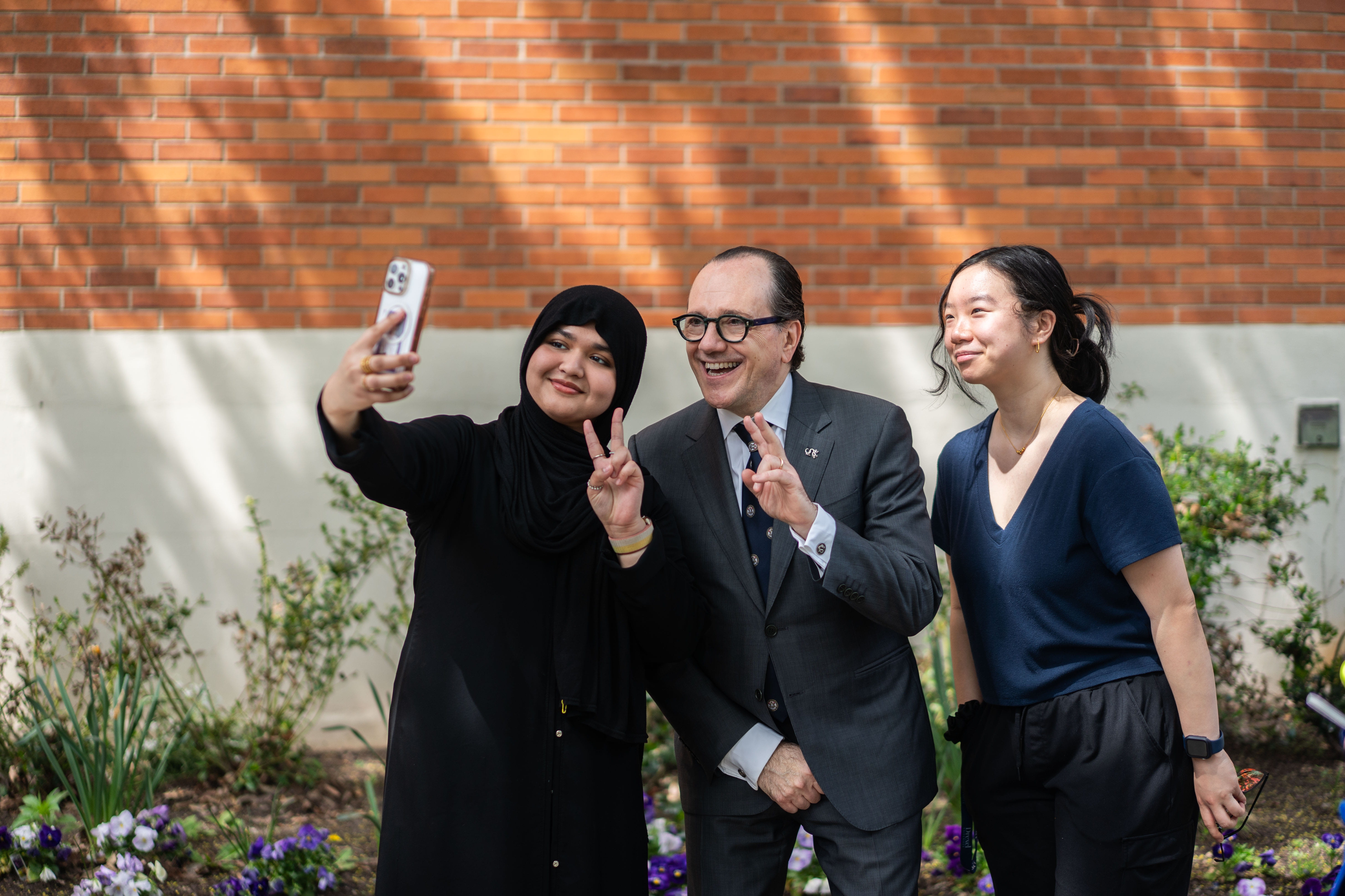 Merlo takes a selfie with students