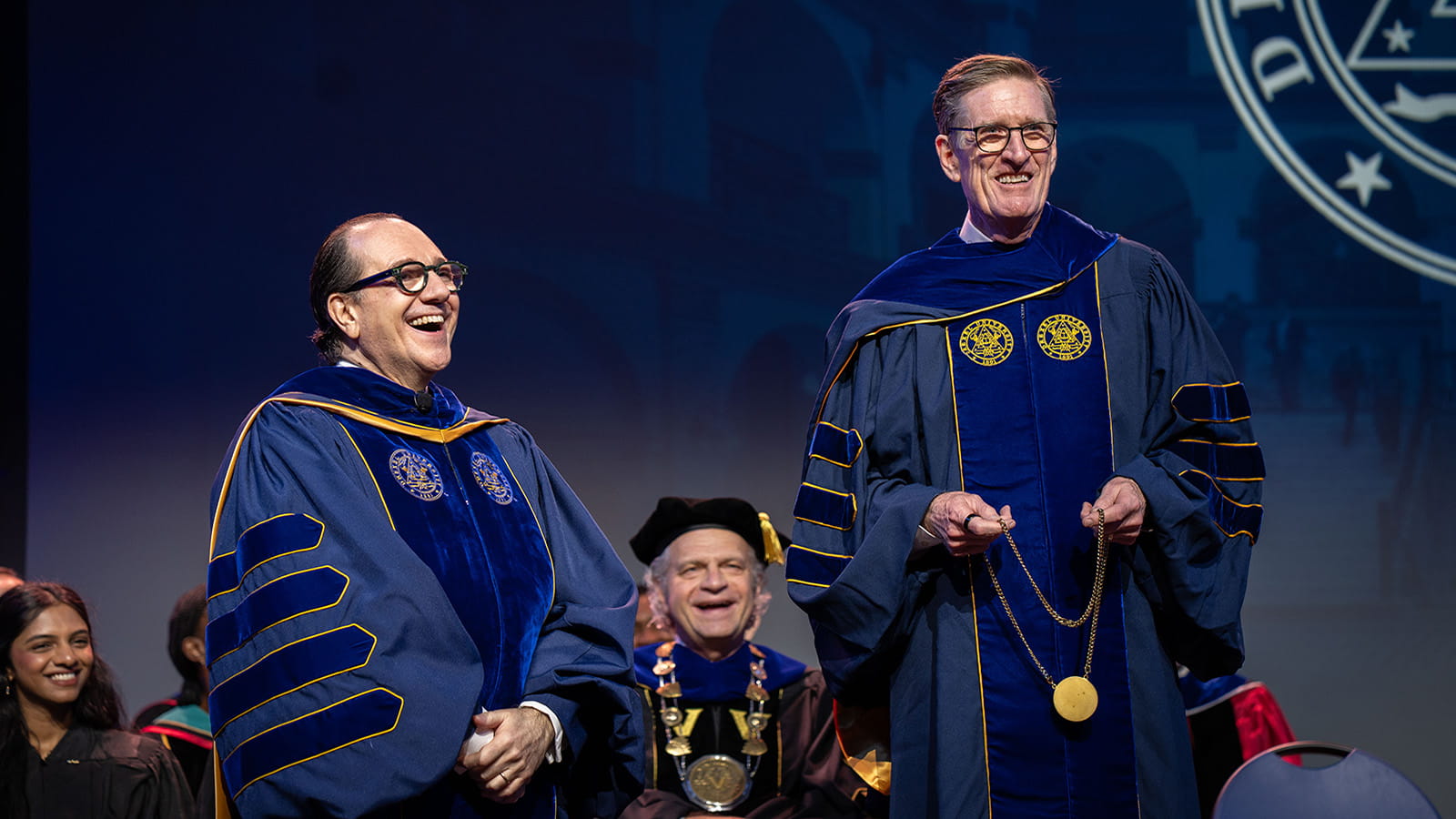 Antonio Merlo, left, and Denis O'Brien on stage at Merlo's investiture ceremony.