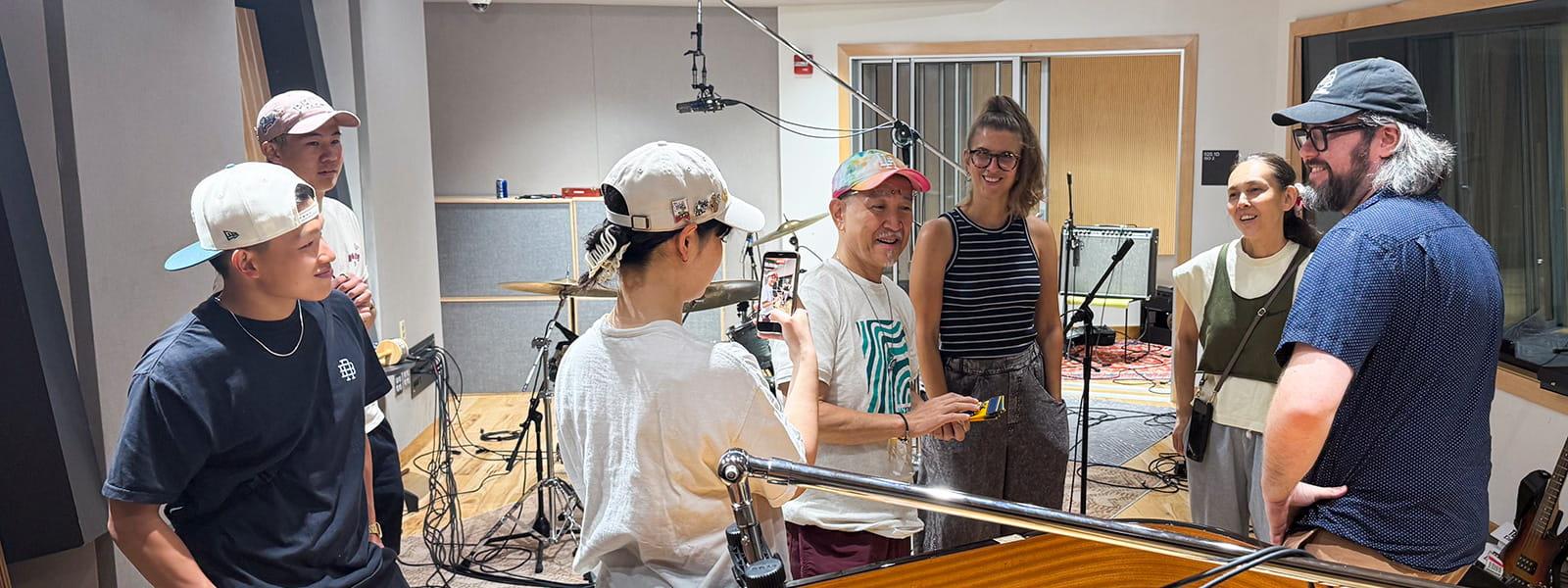 The Chujos and their staff — Daito Kashiwabara, Ayaka Ikeda and Renpei Washizu — shot behind-the-scenes content during their tour of the Music Industry Program’s flagship recording studio, Studio One, as Julien and Brendan Monahan, studio manager, looked on. Photo courtesy Monika Julien.