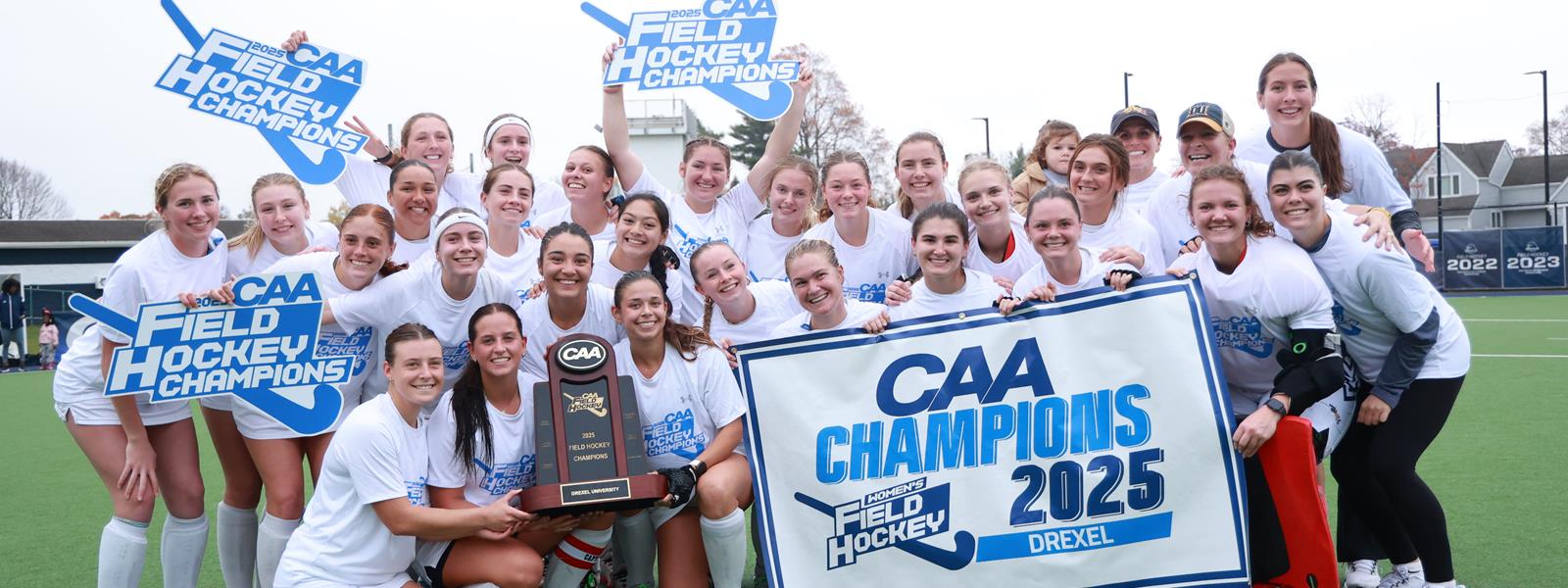 The field hockey team poses with a CAA Champions 2025 banner