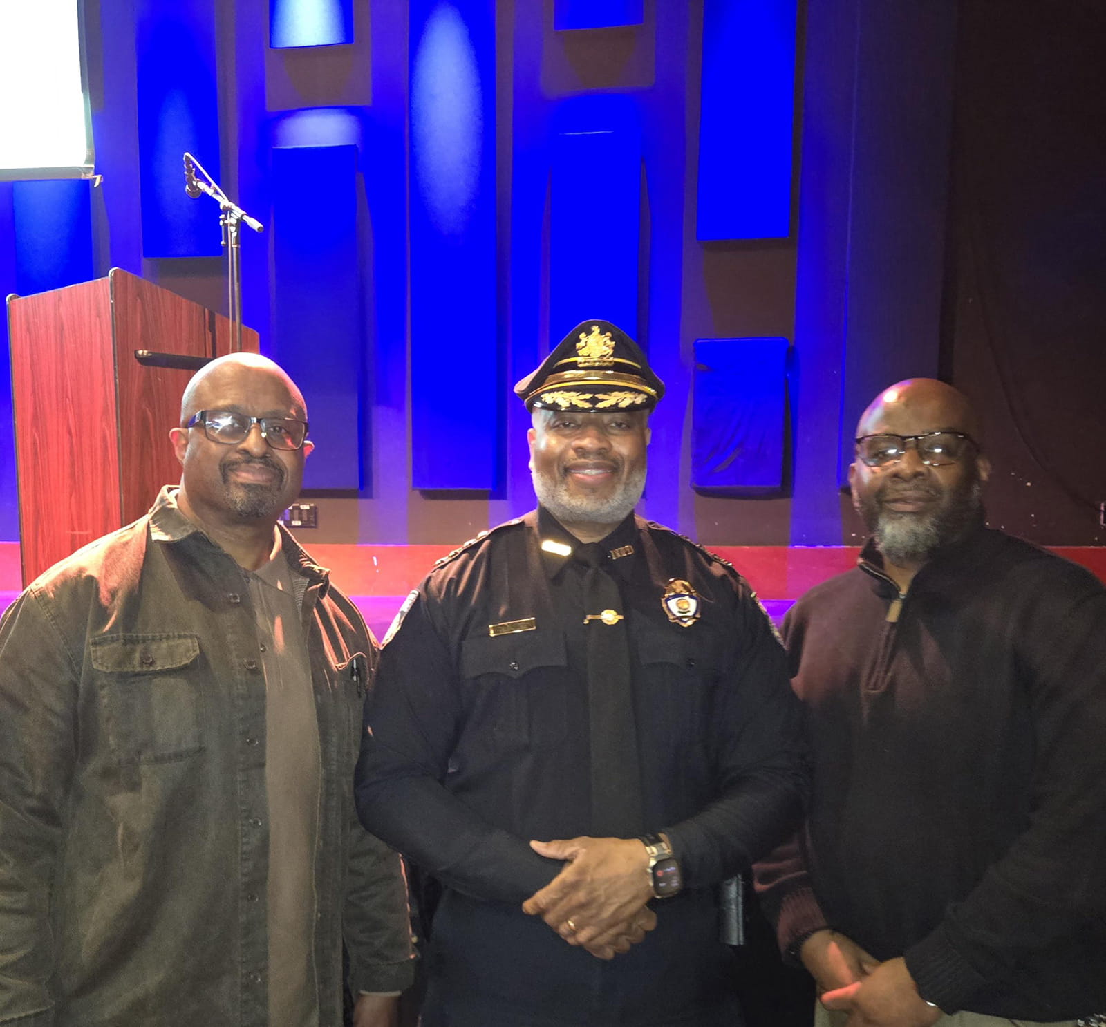 Civilian Investigator Andrew Maddox (pictured at right) with two other men.