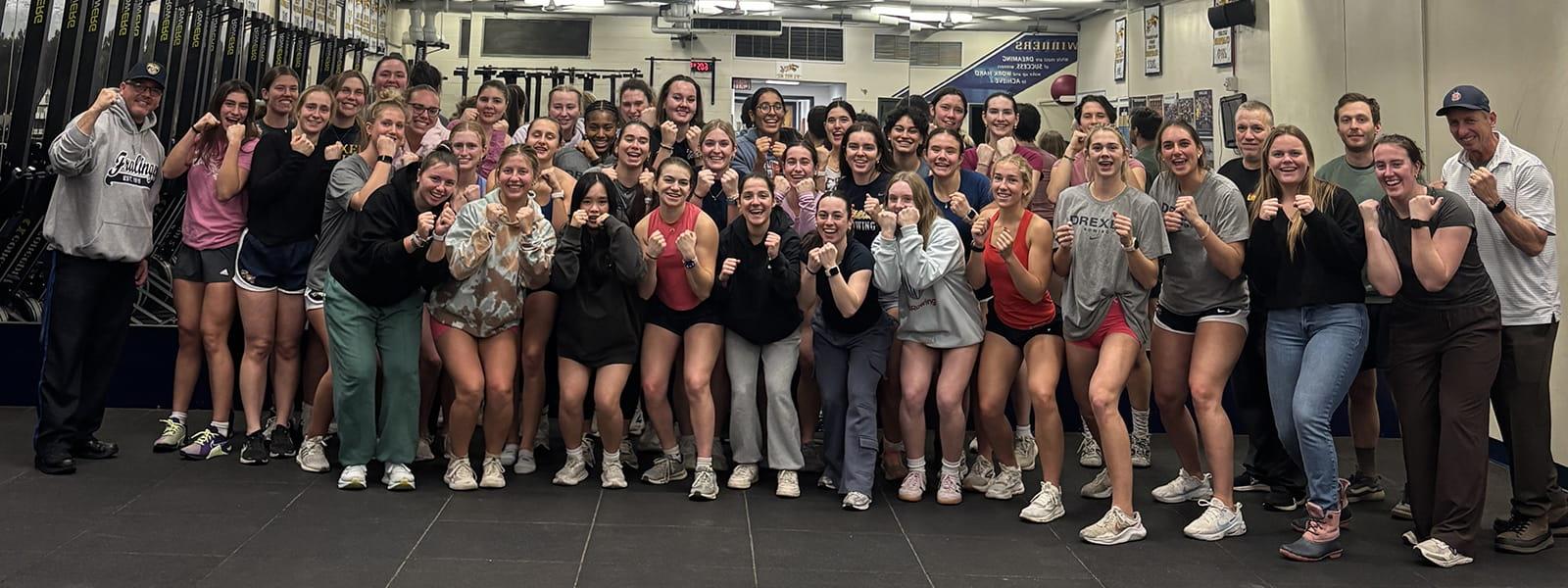 Drexel's women's rowing team lined up in rows after completing a public safety course.