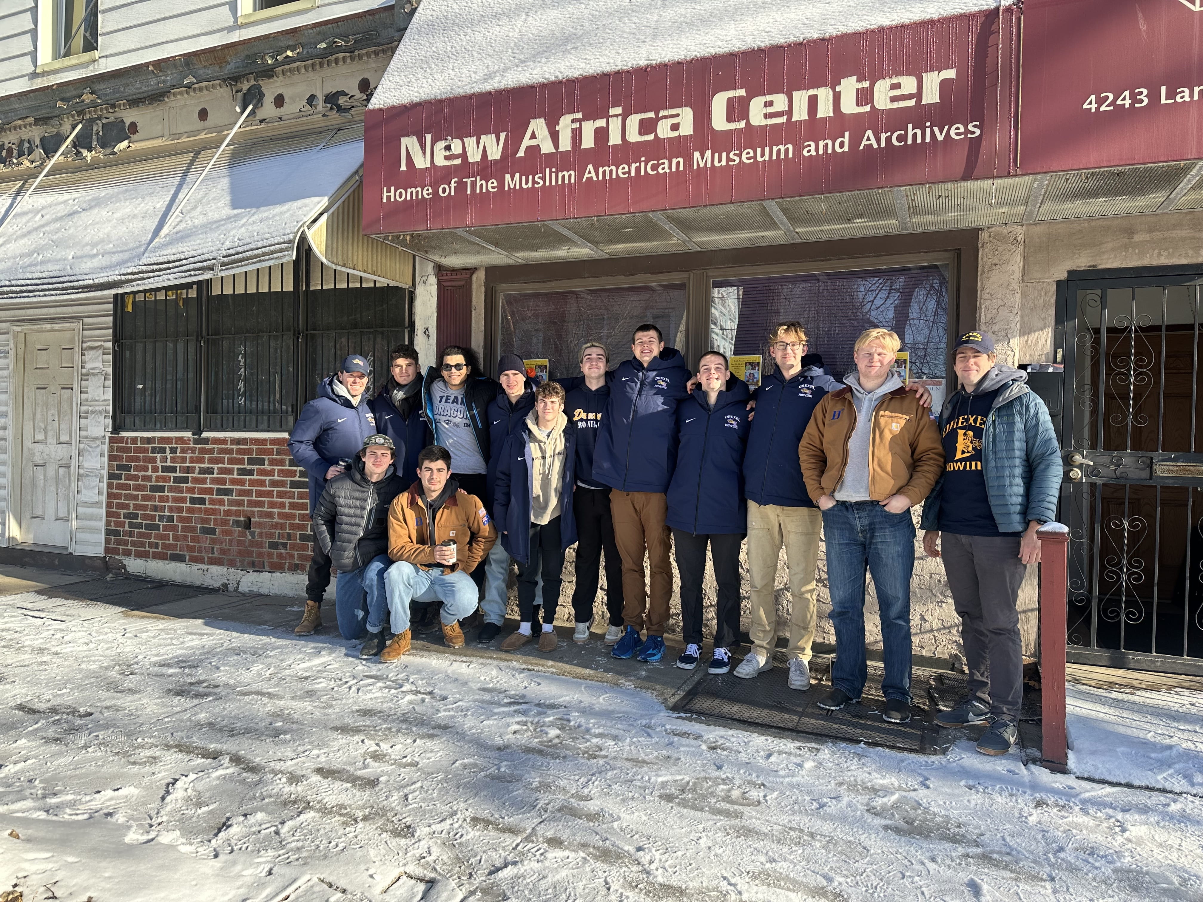 Rowing athletes pose for a photo at the New Africa Center