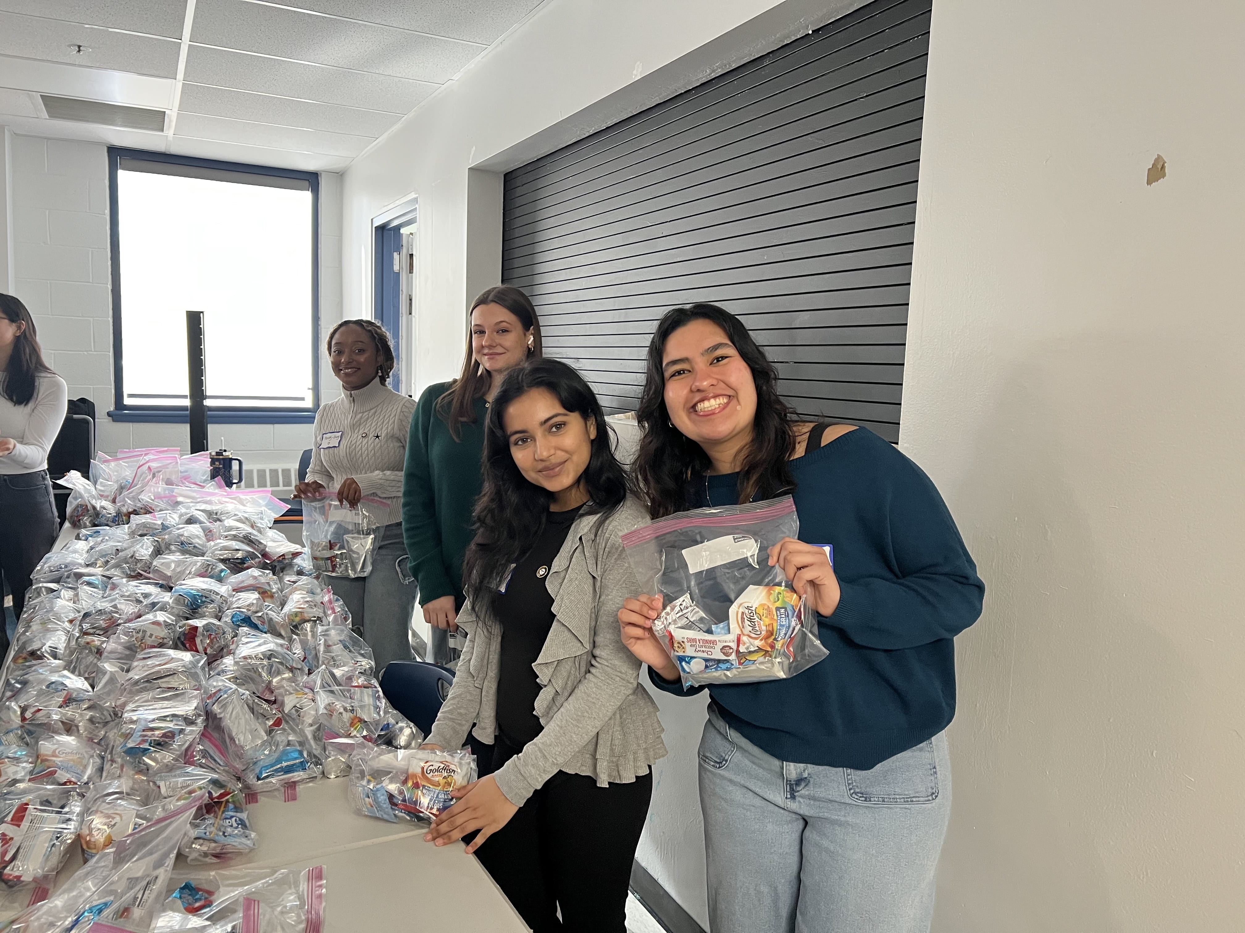 Students pack kits at the Dornsife Center