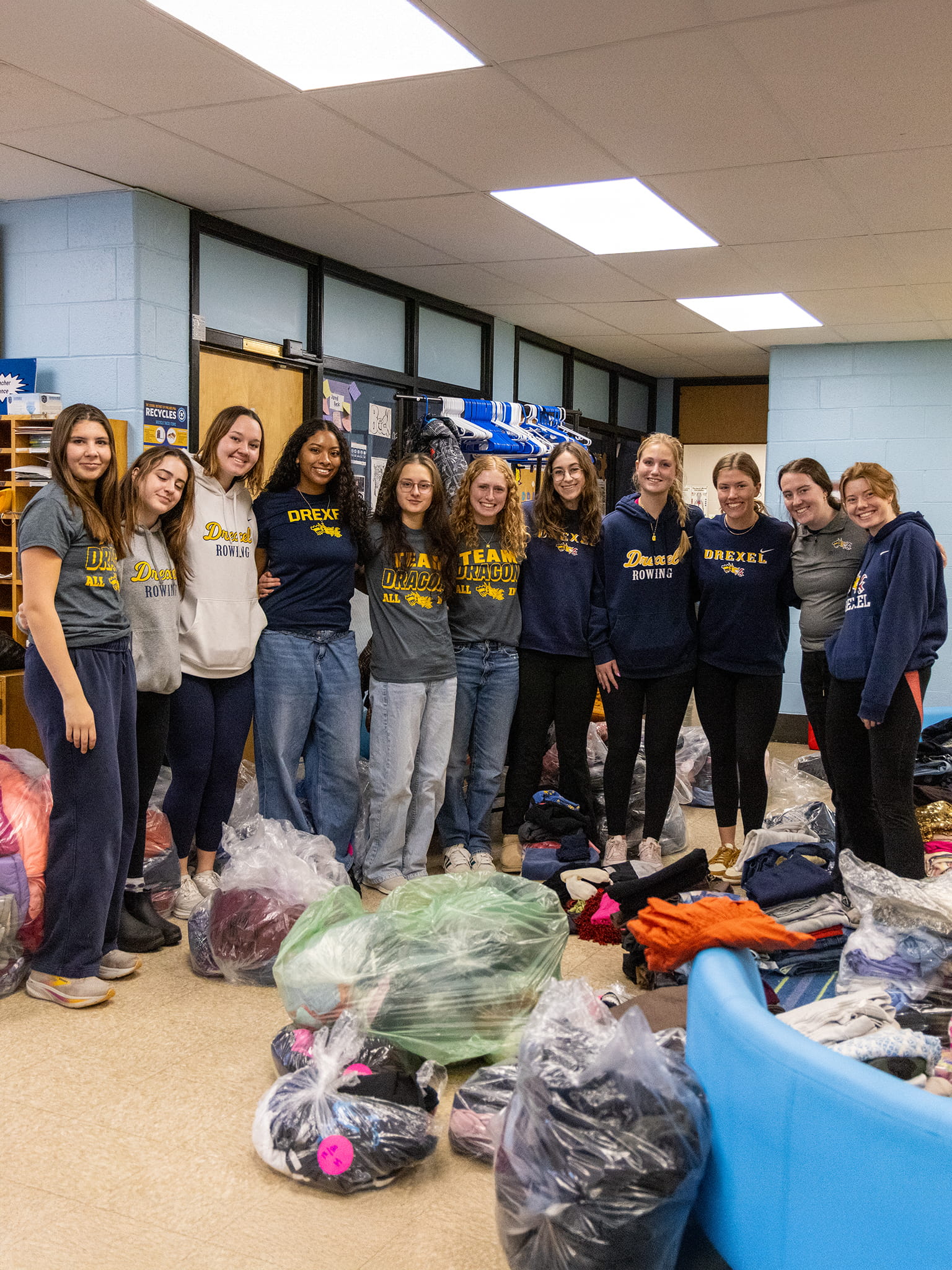 A group of students poses for a photo during a volunteer event