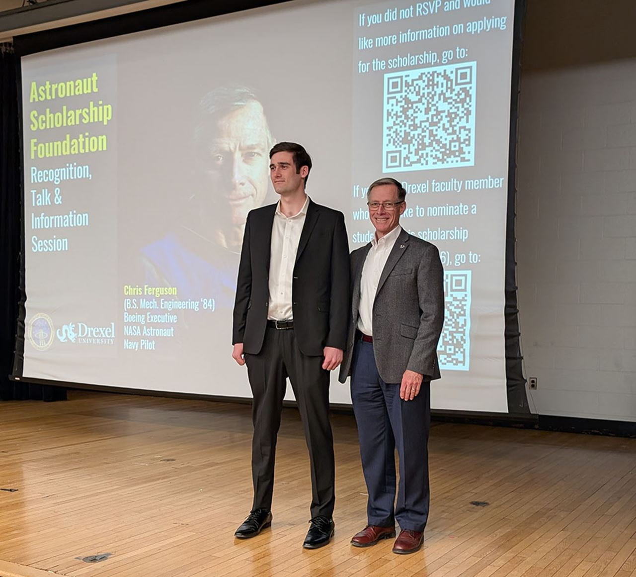 Thomas O'Keeffe, left, with Christopher J. Ferguson on stage.