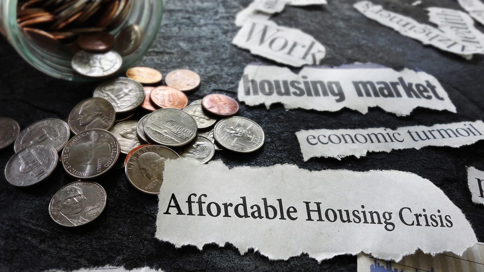newspaper clippings stating an affordable housing crisis and related economic news and spare change