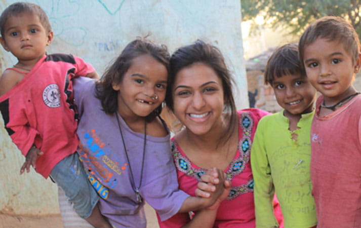 Drexel student Rina Patel with children in India 
