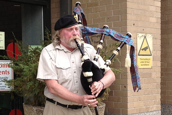 Curt Anderson playing bagpipes