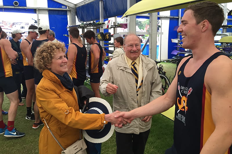 All smiles after beating Dublin. Alumna Sandy Sheller and her husband and Drexel Board of Trustee member Steve, congratulate senior Dan Palombo after the race.