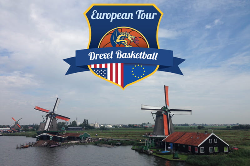 The logo for the women;s basketball team's trip to Europe overtop a scene of the Dutch countryside with windmills.