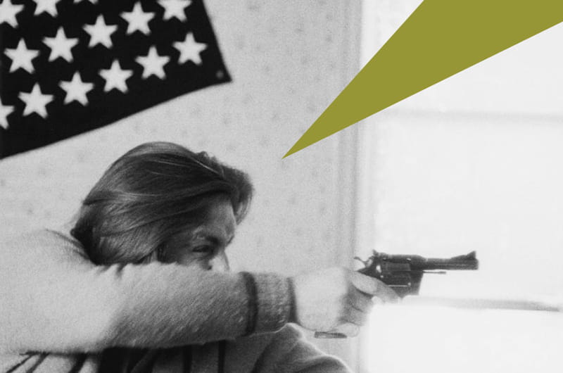 A photograph of a man holding a gun from Larry Clark's Tulsa series.