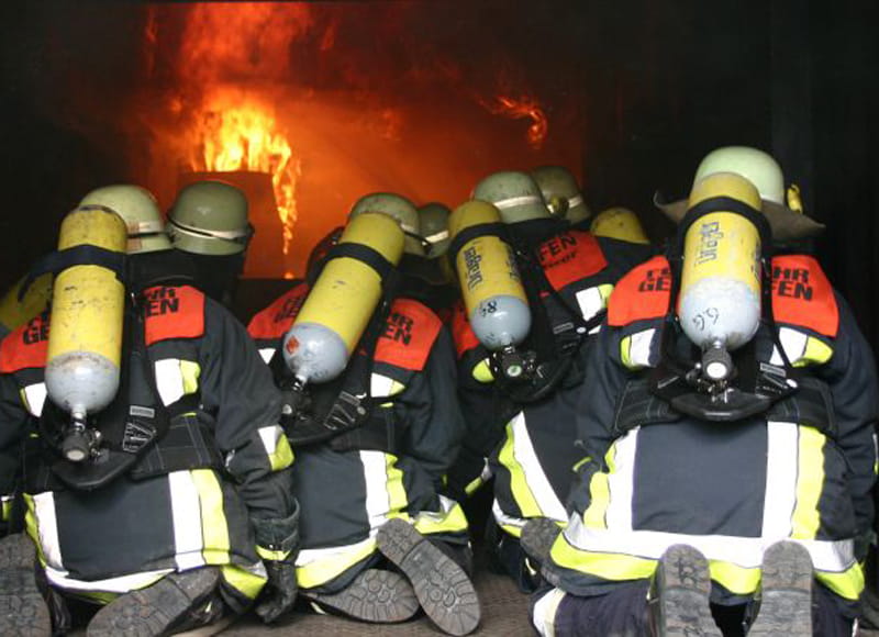 A team of firefighters wearing safety gear.