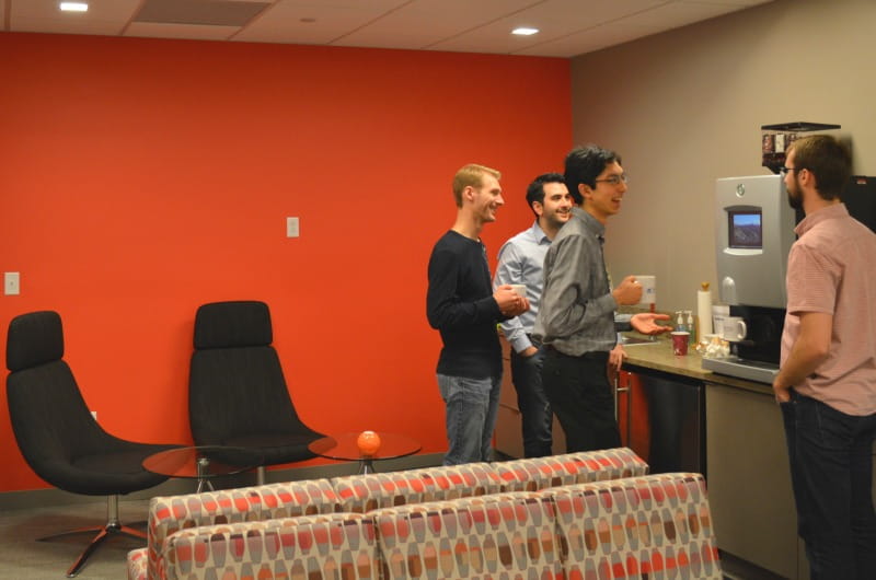 Graduate students enjoy coffee and conversation in the Graduate College's new space. 