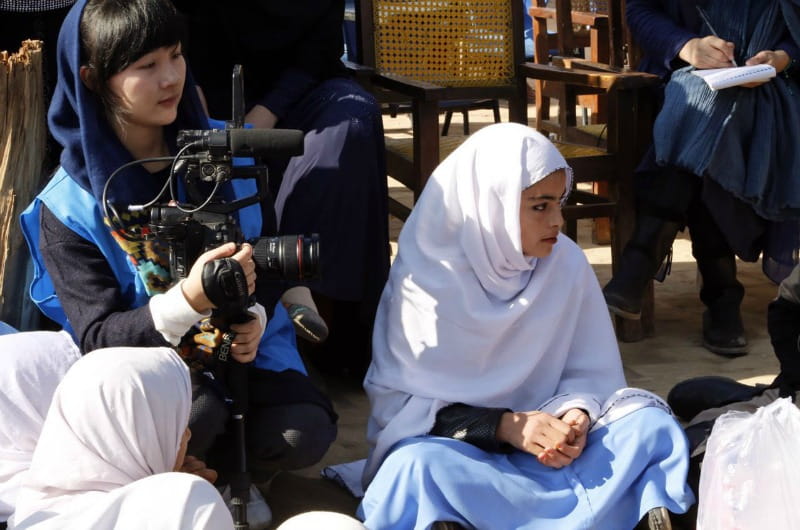 Lili Mao filming a documentary in Pakistan.