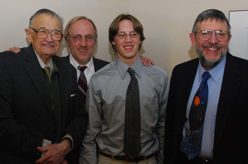 Left to right, Paul Kaczmarczik, Paul Michael Kaczmarczik and Mike Kaczmarczik pose with Nobel Laureate and 13th Kaczmarczik Lecture speaker William D. Phillips at the 2008 event.