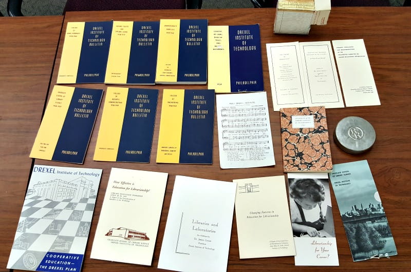 A sampling of the memorabilia stored in the cornerstone box found in the Korman Center that is now being stored in University Archives.
