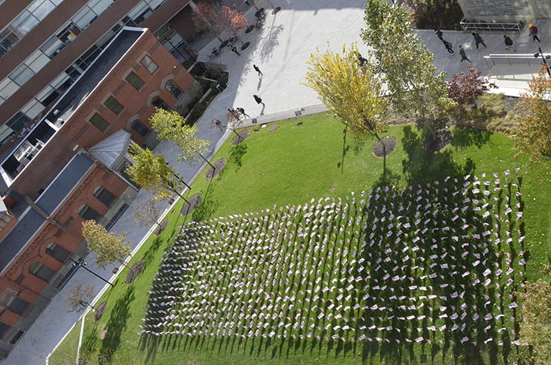 The view of the flag installation from the fifth floor of the Gerri C. LeBow Hall.