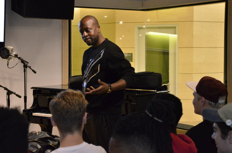 Wyclef Jean performs an a cappella rap for music industry students.
