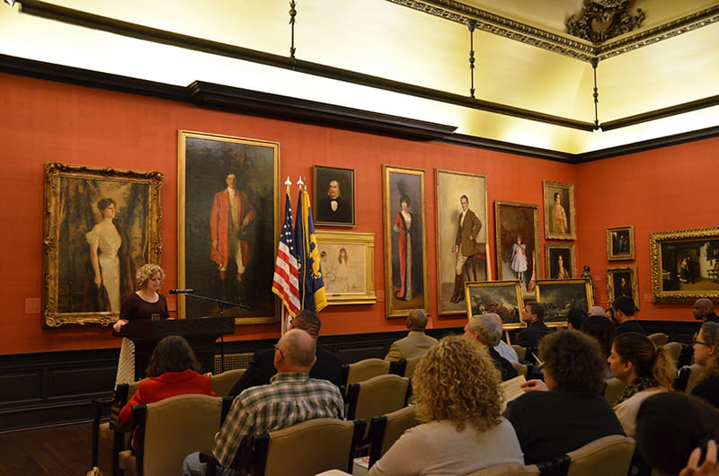 Lynn Clouser, director of The Drexel Collection, speaking at an event in the A.J. Drexel Picture Gallery for Veteran's Day.