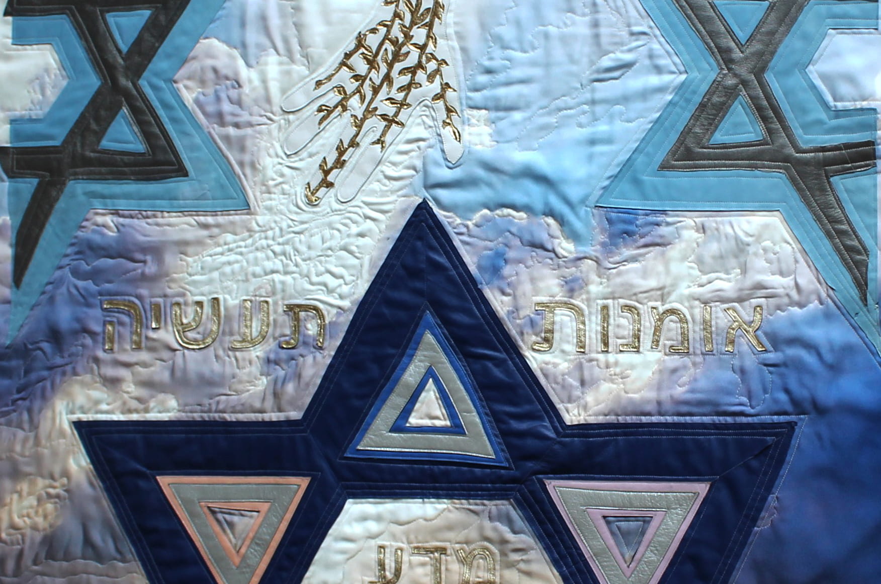 Artwork that depicts golden hand of God and blue star of David