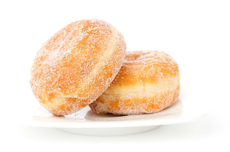 A pair of donuts on a white plate.