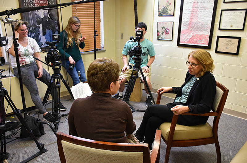 Dean Paula Marantz Cohen, left, and Roz Chast are filmed by Drexel students Lucy Moroukain, Laurel Murr and Louis Togna (L-R) for an episode for "The Drexel InterView." 