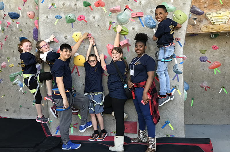This group of 12-year-olds had fun at Drexel's climbing wall.