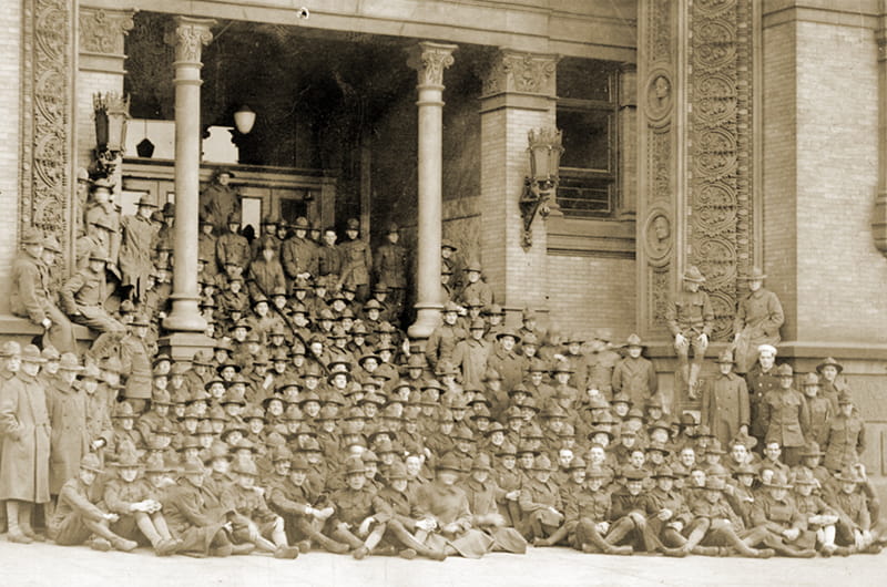 The Students Army Training Corps (SATC) allowed men to both enlist in the military and enroll in college in the fall of 1918. This photograph shows Drexel's SATC unit gathered on the steps of the Main Building. Photo courtesy Drexel University Archives.