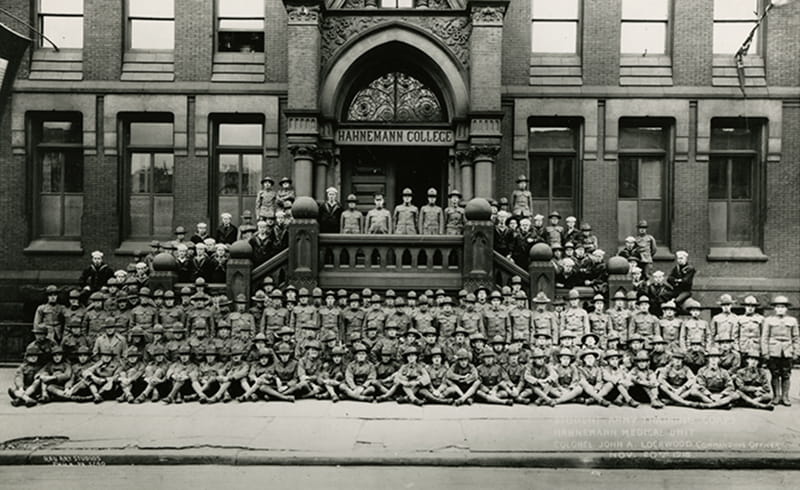 Hahnemann unit of the Student Army Training Corps in 1918, including students still in training at the end of World War I (classes 1919–1922) on the steps of the Broad Street college building. Photo courtesy Legacy Center Archives, Drexel College of Medicine.