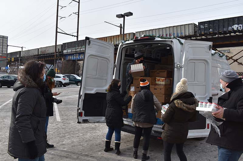 Drexel professional staff distributing food on Dec. 19 for the Alumni Turkey Project.