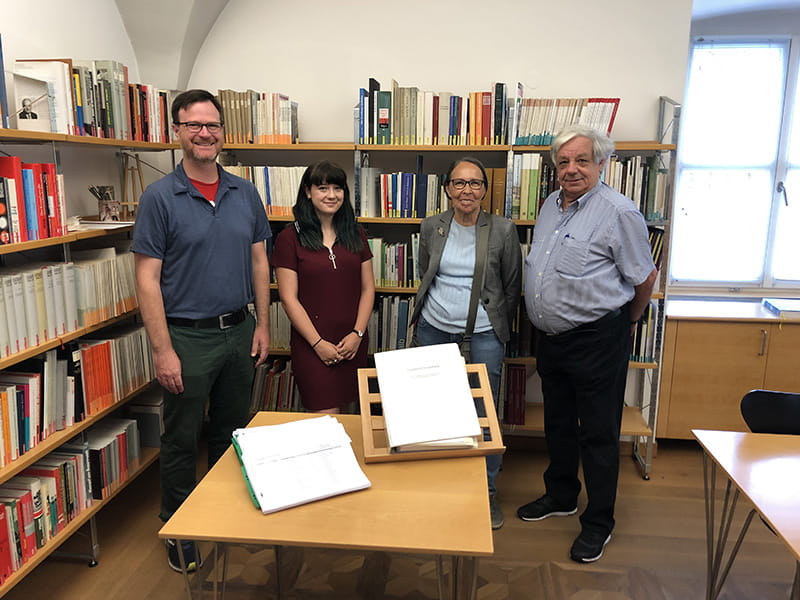 Left to right: Scott Knowles, Isabella Sangaline and Hildegard Oprießnig and Bruno Oprießnig, volunteers who helped transcribe old documents for Sangaline's co-op. Photo credit: Dornbirn City Archives.