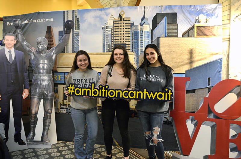 From left to right: Karli Akin, Sarah Scanlin and Erika Garro, all second-year engineering students embarking on their first co-op this spring, attend the Co-op Send-off event at Drexel University's Great Court.