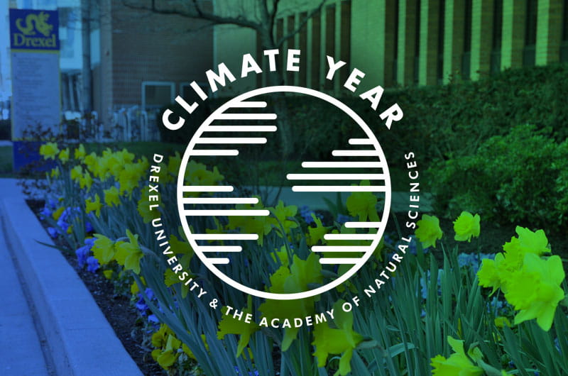 The University's Climate Year logo over a background of flowers on campus.