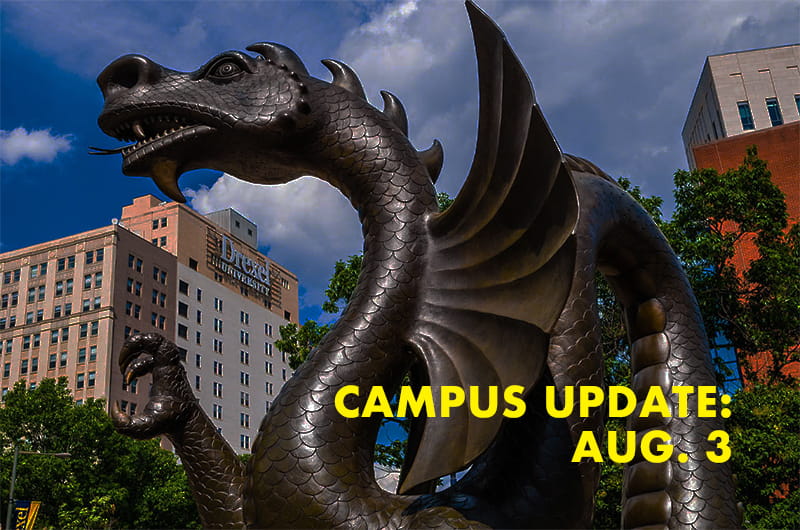 Dragon statue with the text campus update August 3