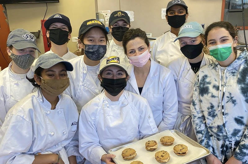 A photo of some of the Drexel volunteers, courtesy of Carrie Madden (holding the chocolate chip and peanut butter cookie sandwiches she baked for the story).
