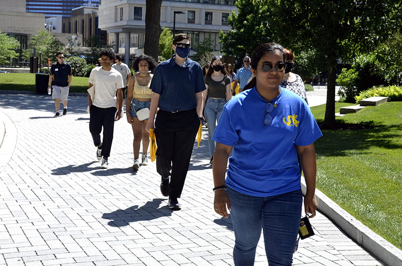 Esta Jacob, a rising second-year finance and legal studies major and student ambassador, takes a campus tour through the academic quad.