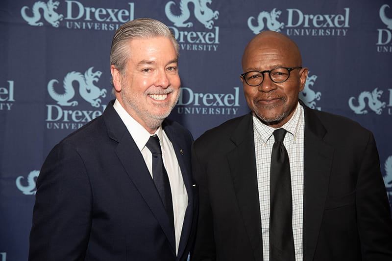 Drexel President John Fry, left, with Commencement speaker and honorary degree recipient Elijah Anderson, PhD.