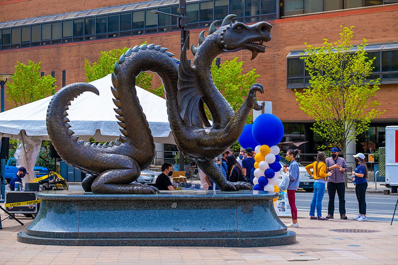 Activity around the Mario the Magnificent statue on the University City Campus during a "Walking Tour Weekend!" event in April 2021. Photo credit: Jeff Fusco.