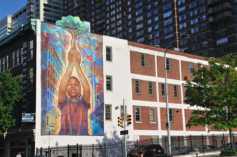 The "Reach High and You Will Go Far" mural by Josh Sarantitis at 20th and Arch streets. 