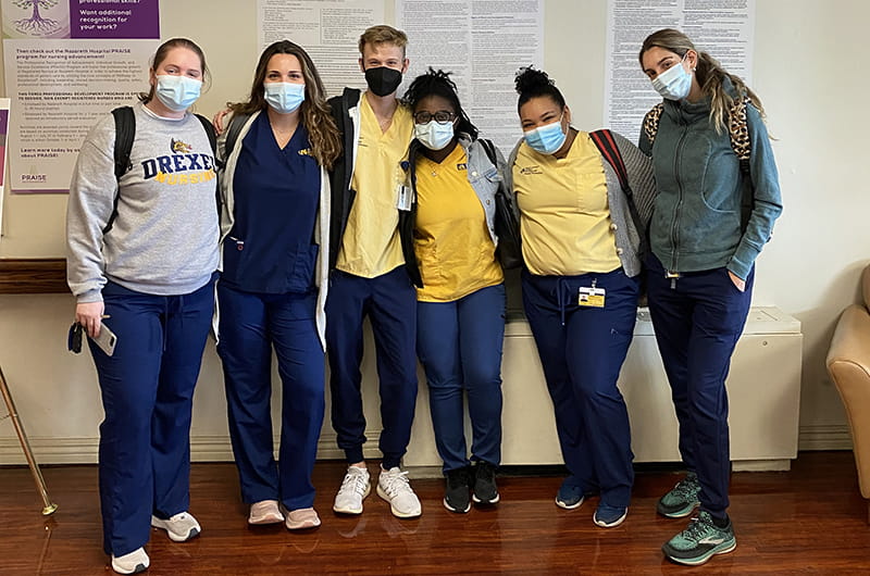 Keyanna Bynum (third from right) poses with fellow nursing students during the last academic year at their final clinical.