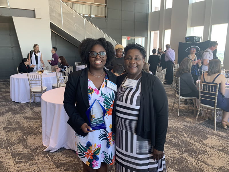 Bynum (left) and Roberta Waite, EdD, professor in doctoral nursing and associate dean of Community-Centered Health & Wellness and Academic Integration, posing together at the Macy Undergraduate Leadership Fellows Program award ceremony.