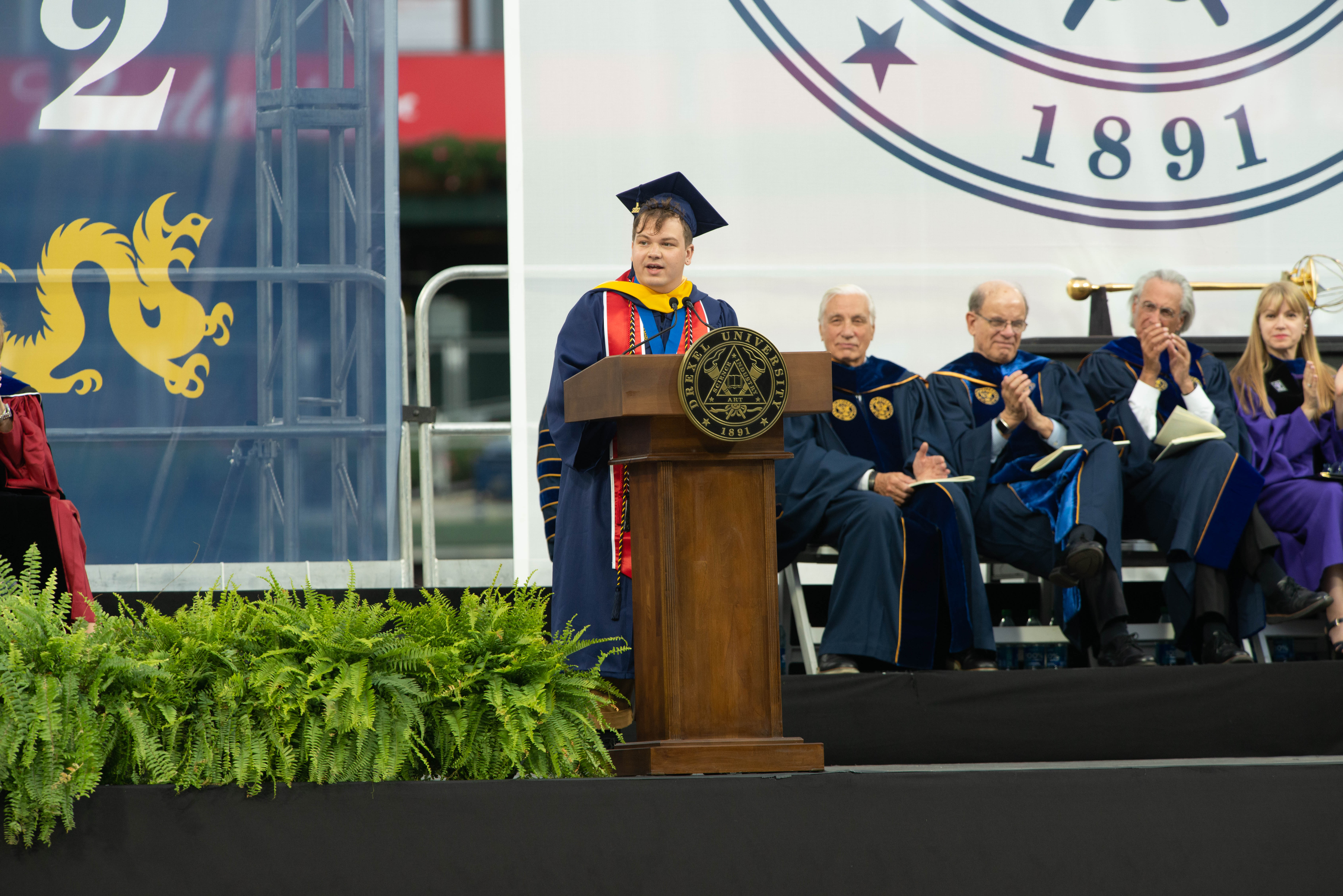Jarod Watson, BS entertainment and arts management ‘22, at the podium at Drexel's 2022 Commencement. Photo credit: Kelly & Massa Photography.